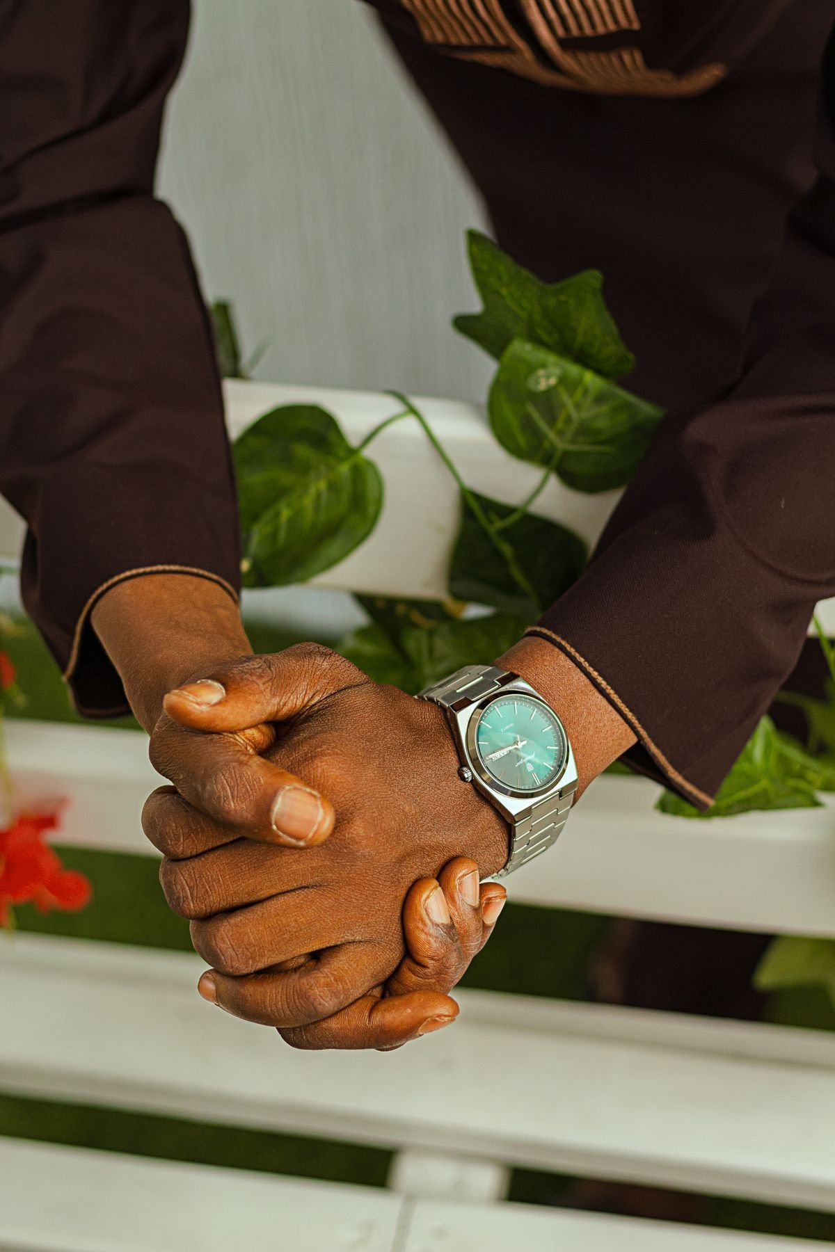 Man trying on a wristwatch while learning how to pick men's accessories that suit him